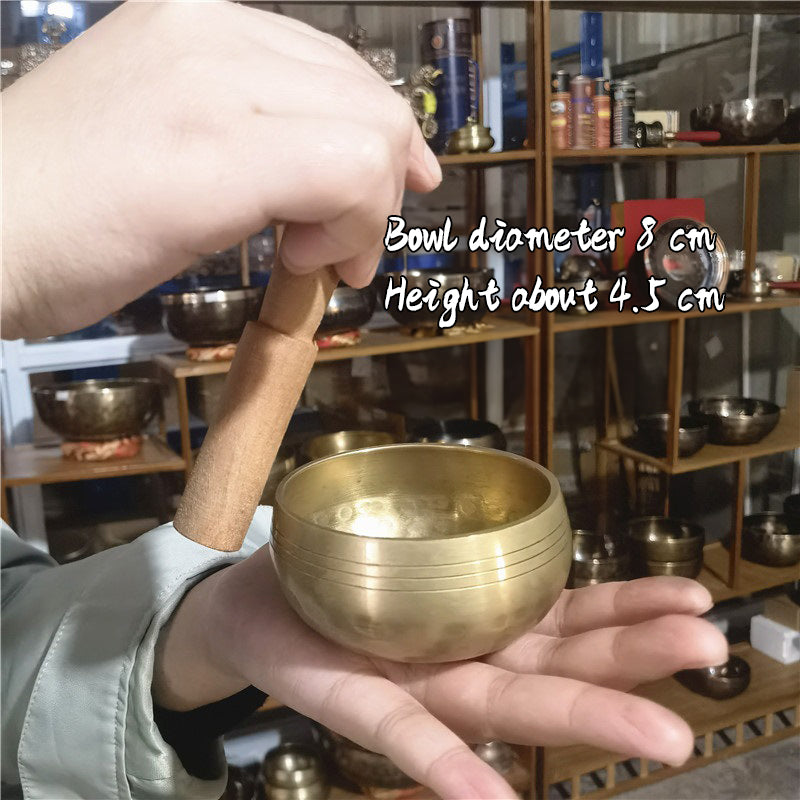 Tibetan brass singing bowl with Sanskrit – handmade meditation instrument for stress relief.