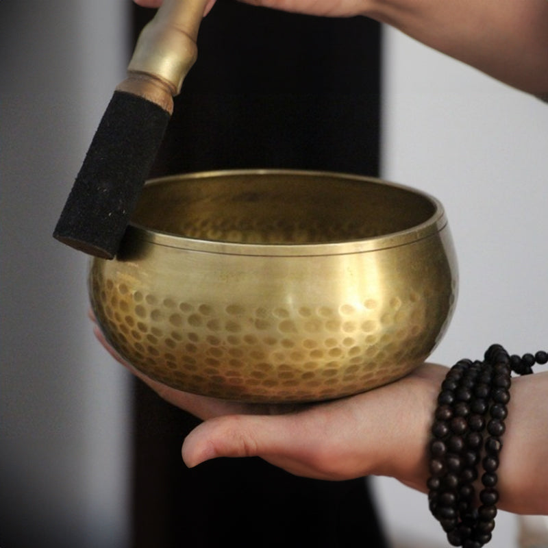 Tibetan brass singing bowl with Sanskrit – handmade meditation instrument for stress relief.
